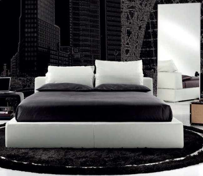 Chambre noire et blanche avec lit podium