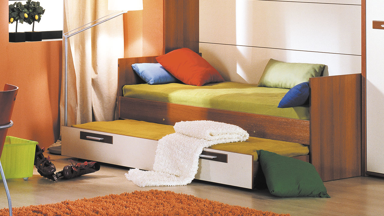 Un lit gigogne à la chambre