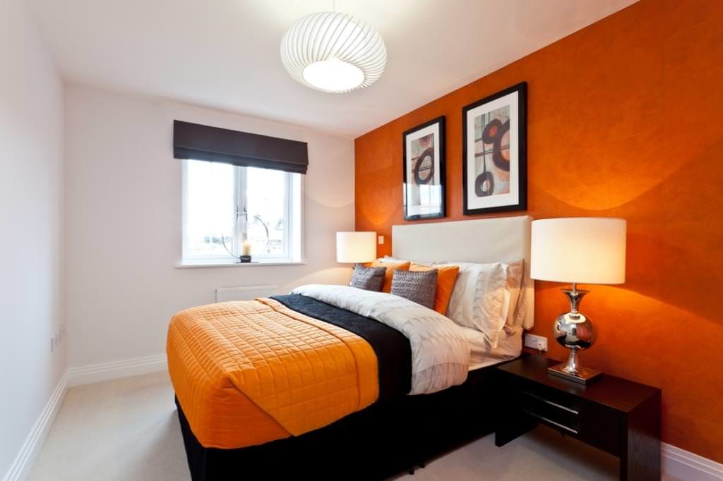 Conception de chambre à coucher avec un lit orange