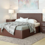 Lit avec mécanisme de levage